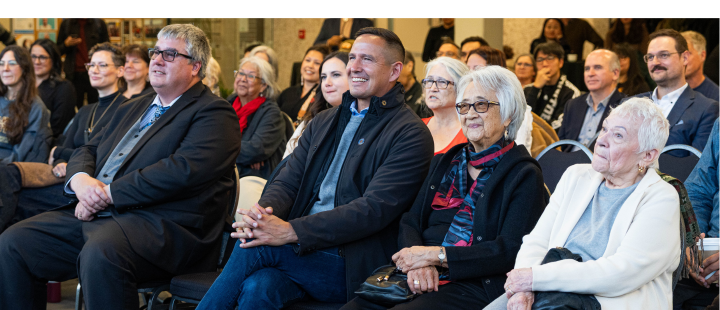 Audience smiling and listening during the Indigenous Studies 50th anniversary event at the University of Manitoba.