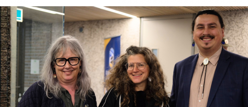 Three attendees smiling together at an Indigenous Studies event.