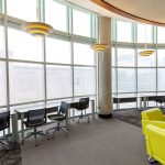A wide shot of the bank of windows and study spaces at NJM Health Sciences Library
