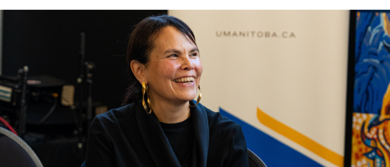 Woman smiling during a University of Manitoba event.
