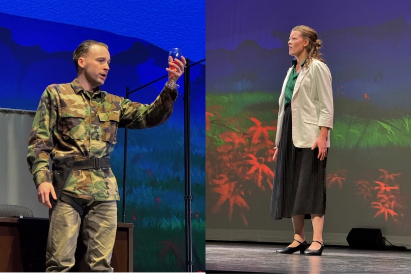 Two students face each other on stage, singing.