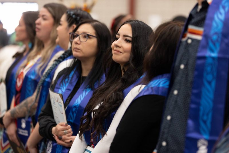Indigenous graduates wear their stoles with pride and emotion. 