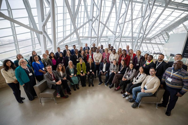 A group of people in a well-lit atrium space