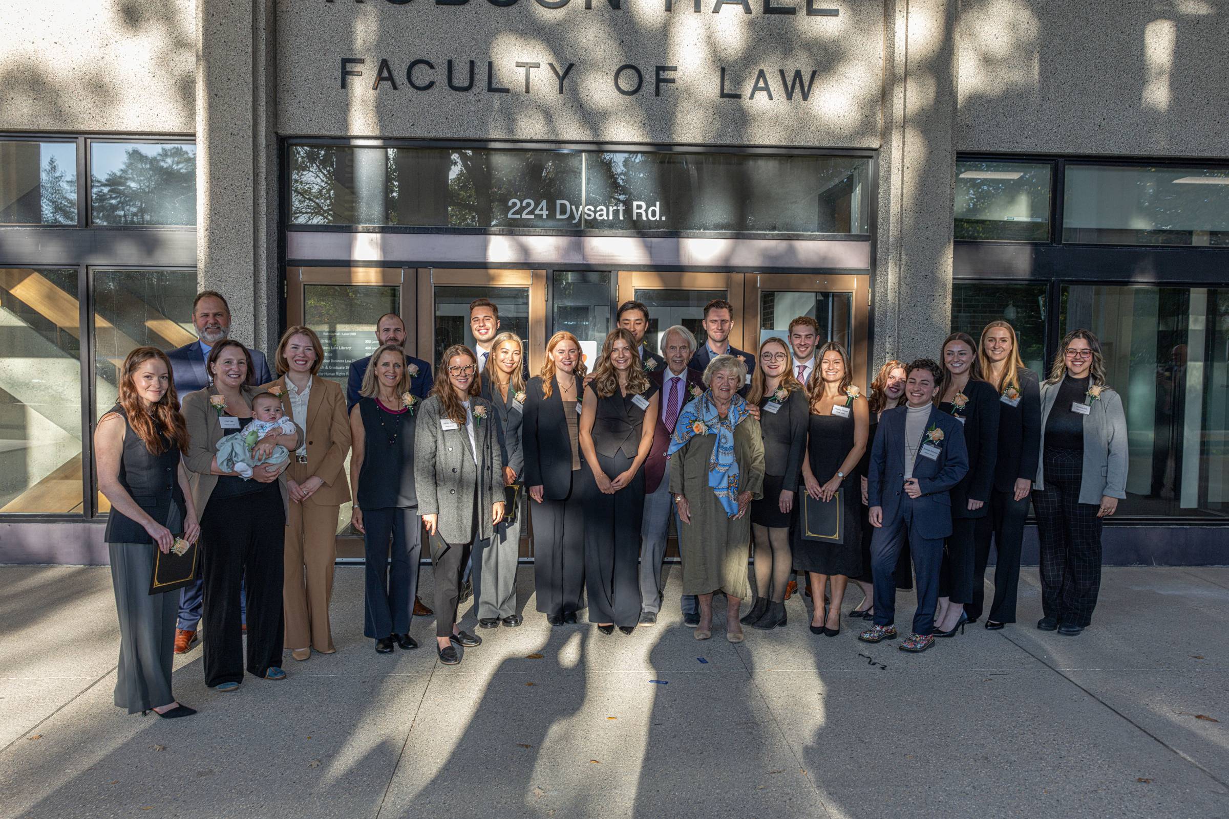 group photo of award recipients with donor in front of Robson Hall
