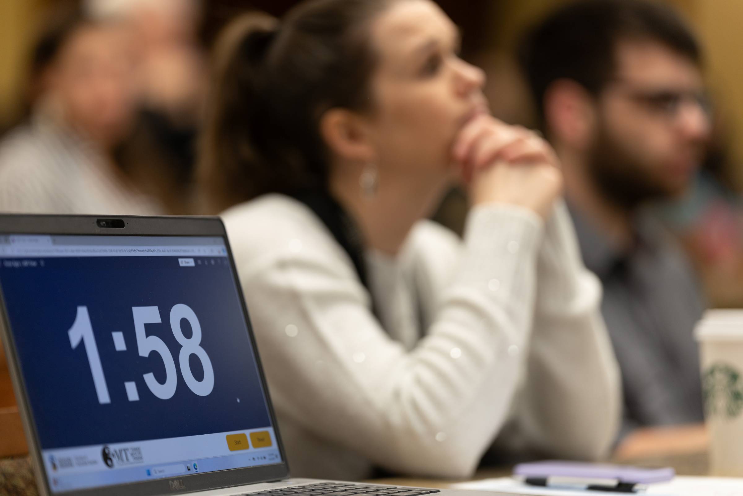 3MT timer with blurred audience members