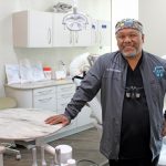 Dr. Tom Colina poses in a dental operatory.