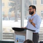 Edgar French speaks at a podium on Bannatyne campus.