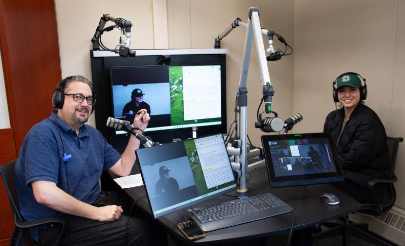 A photo of Dr Richard Jochelson, Dean of Law, seated at the faculty of Law's podcast table with Trechelle Bunn, Chief of the Birdtail Sioux First Nation and a third-year law student at Robson Hall.