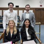 Left to right seated: Co-counsel Jasmine Yakabowich (runner-up) and Priya Dhillon (winner) Left to right standing: Trial “witnesses” Eric Matthews and Brannen McKenzie-Lefurgey (3Ls)