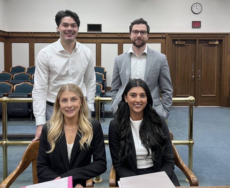 Left to right seated: Co-counsel Jasmine Yakabowich (runner-up) and Priya Dhillon (winner) Left to right standing: Trial “witnesses” Eric Matthews and Brannen McKenzie-Lefurgey (3Ls)