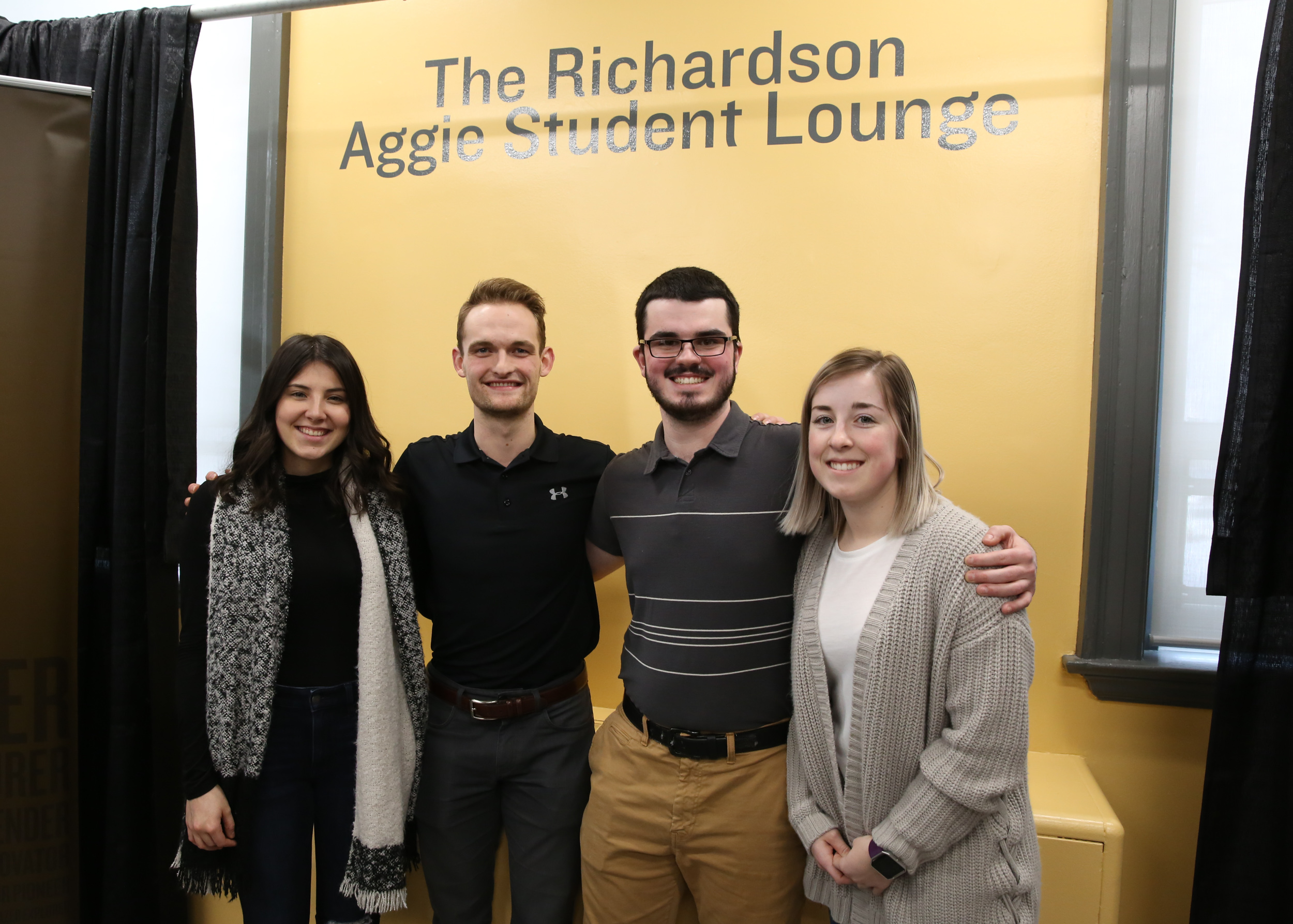 Student lounge renovation committee members Jenna, Brian, Pat and Courtney enjoy the new space