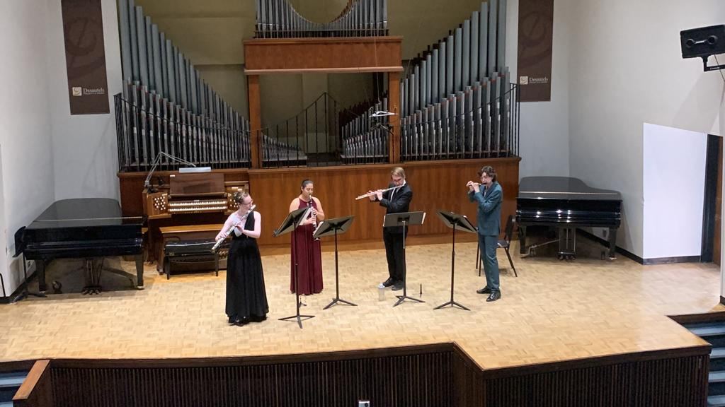 Cal Wiese performs with a flute/clarinet quartet in Eva Clare Hall