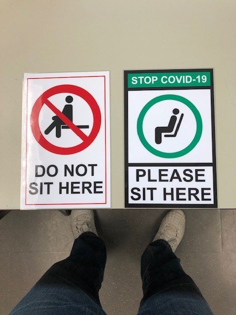 Physical distancing signage for seating.