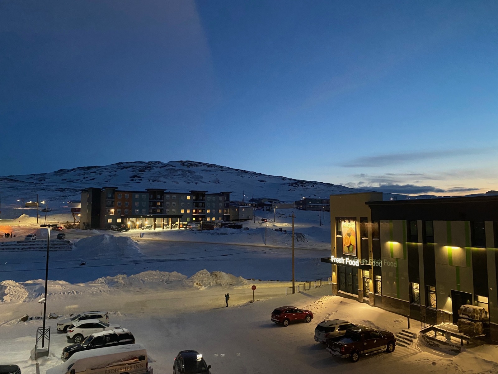 Parking Lot of the Astro Hill building complex, showing Hospital Hill, the highest peak within Iqaluit.