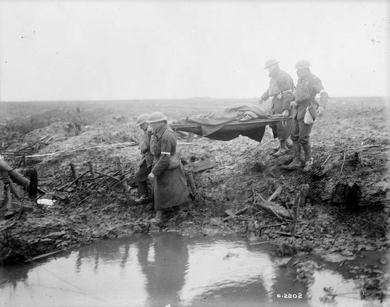 Wounded Canadians on way to aid-post. Battle of Passchendaele. November, 1917. Credit: Canada. Dept. of National Defence/Library and Archives Canada.